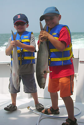 Young anglers with bluefish